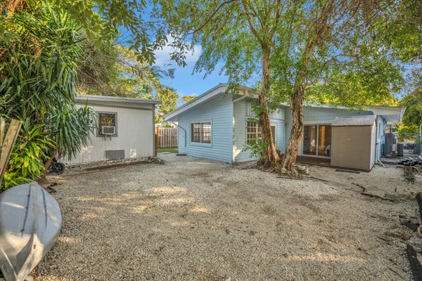 a view of a house with a yard and garage