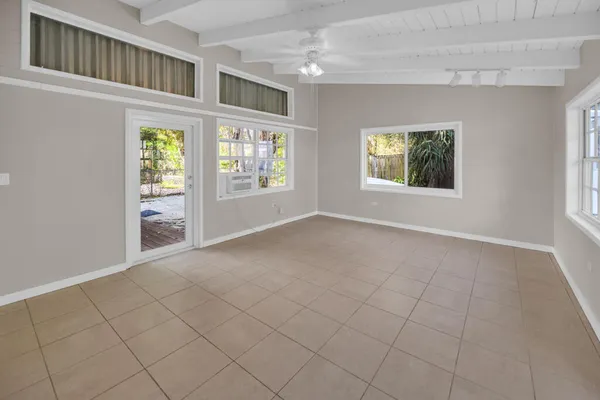 a view of an empty room with a window