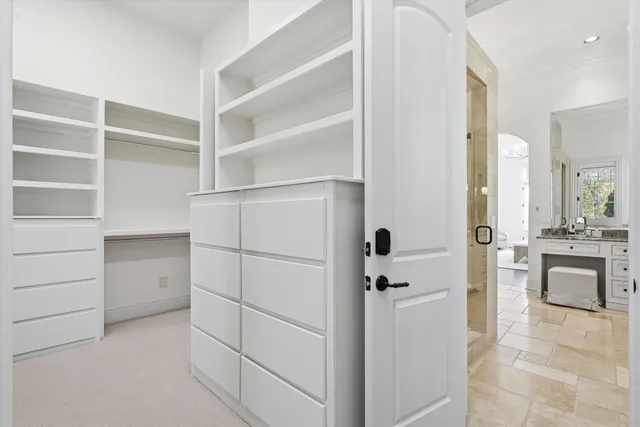 a view of a livingroom with furniture and staircase