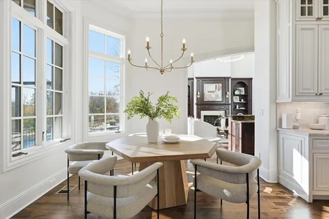 a bathroom with a granite countertop sink a mirror and shower