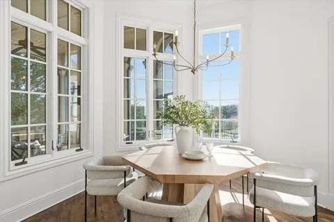 an empty room with floor to ceiling windows