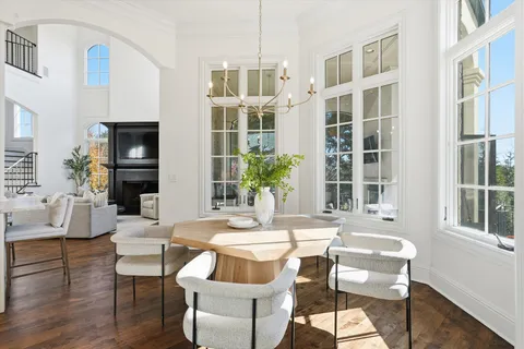a view of a balcony with a floor to ceiling window next to a yard