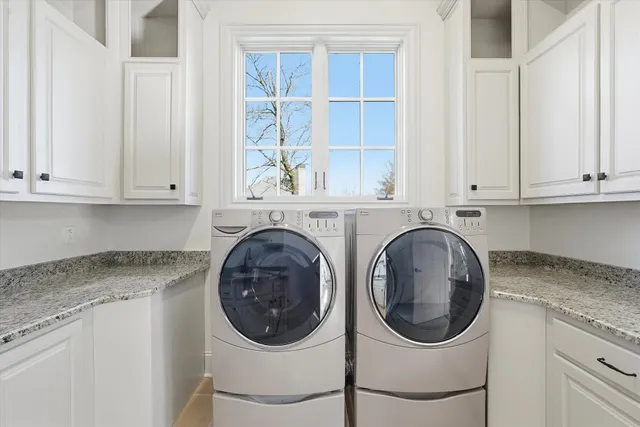 an aerial view of a house with garden space and street view