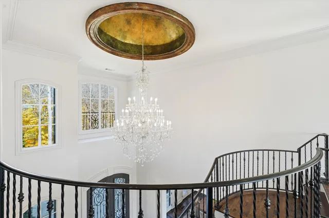 an aerial view of a house with garden space and street view