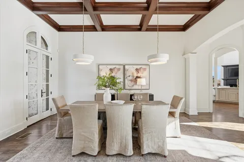 a living room with furniture a fireplace and a large window