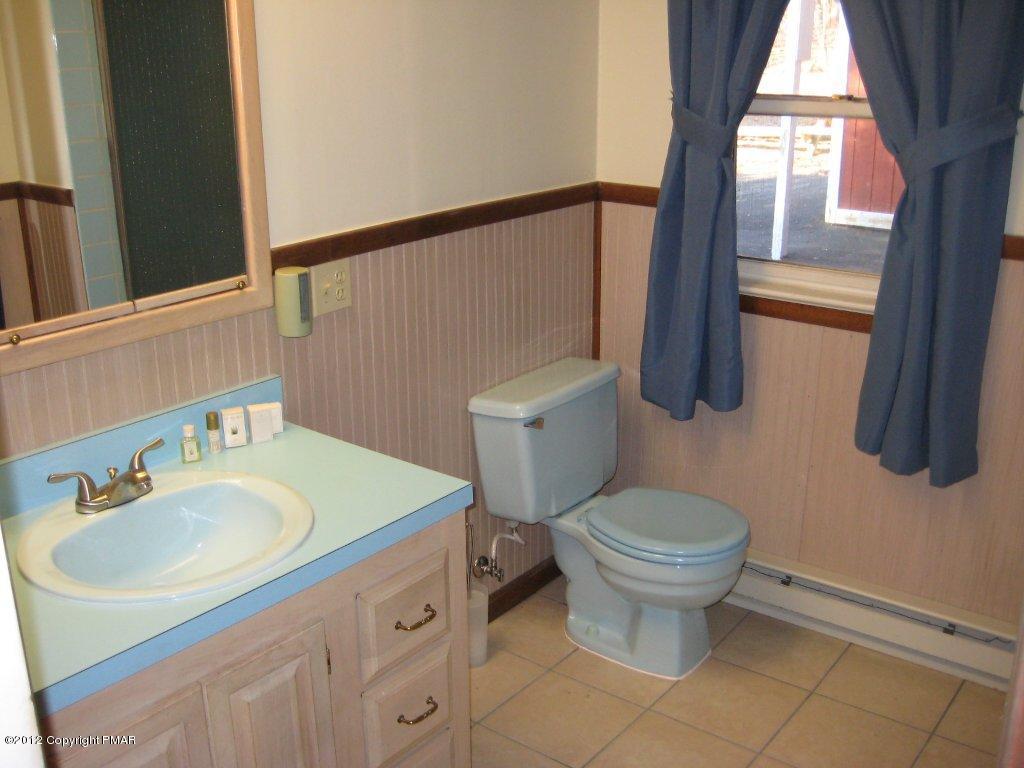 105 Westbrook Road Effort, PA 18330 - Photo 6 of 12 a bathroom with a sink toilet and window