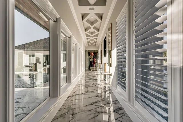 a view of a hallway with a glass door