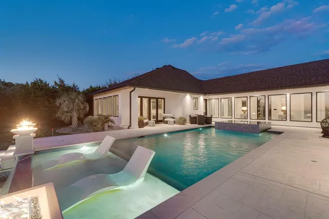 a view of pool with outdoor seating