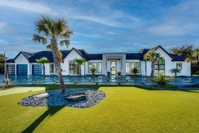 a view of house with swimming pool outdoor seating and yard