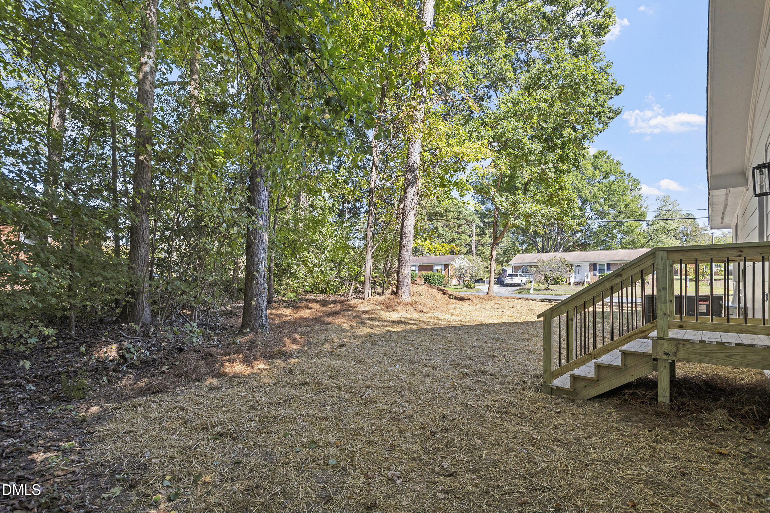1311 Castlebay Road Durham, NC 27704 - Photo 32 of 39 a view of a yard with wooden fence and a bench