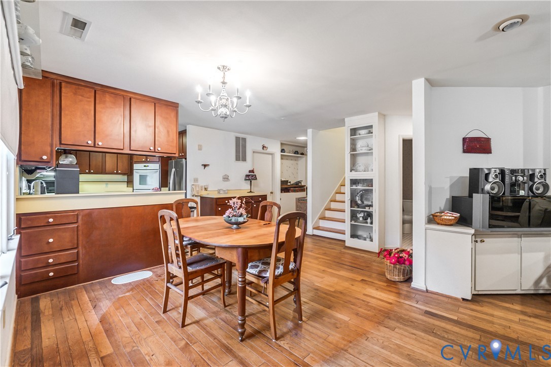 2086 Defense Road Petersburg, VA 23805 - Photo 12 of 32 Dining area featuring a chandelier, light wood-sty