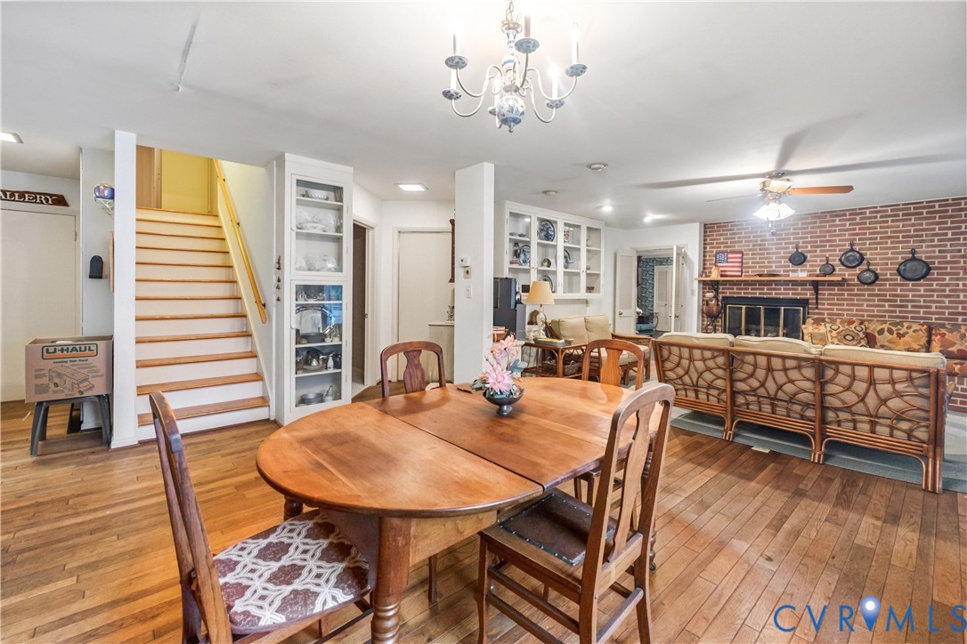 2086 Defense Road Petersburg, VA 23805 - Photo 13 of 32 Dining area featuring stairway, a brick fireplace,