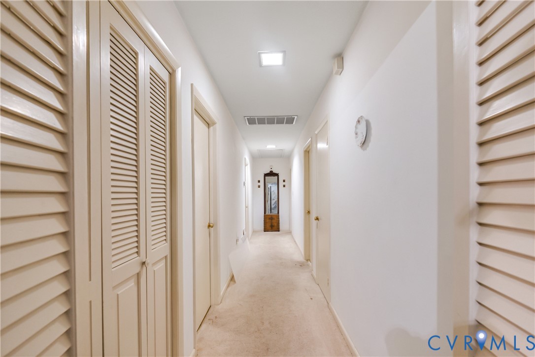 2086 Defense Road Petersburg, VA 23805 - Photo 21 of 32 Corridor with carpet and baseboards