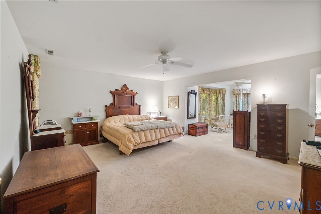 2086 Defense Road Petersburg, VA 23805 - Photo 26 of 32 Bedroom with light carpet and ceiling fan