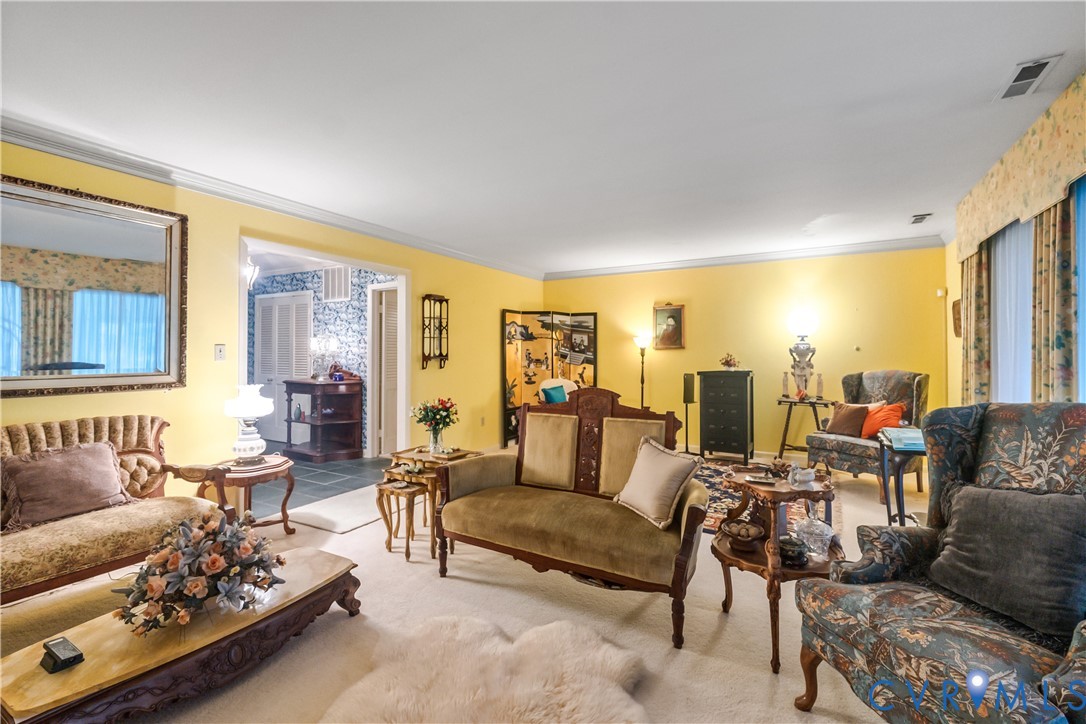 2086 Defense Road Petersburg, VA 23805 - Photo 8 of 32 Carpeted living room with crown molding
