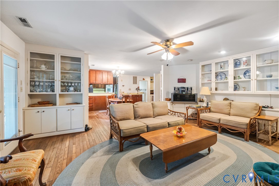 2086 Defense Road Petersburg, VA 23805 - Photo 10 of 32 Living area with light wood finished floors, a cha