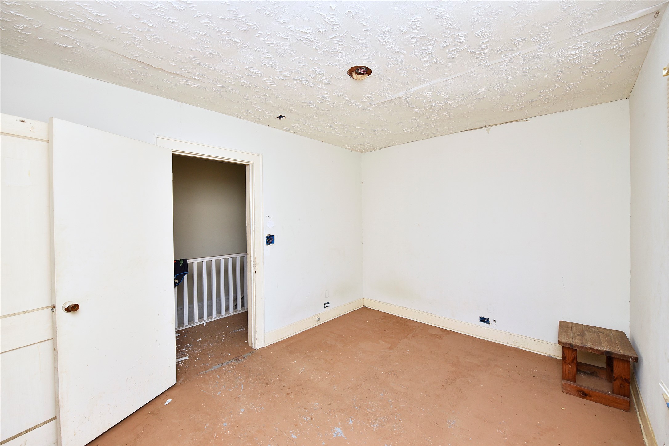 908 6th Street Rosenberg, TX 77471 - Photo 29 of 34 a view of a livingroom with a hallway and stairs