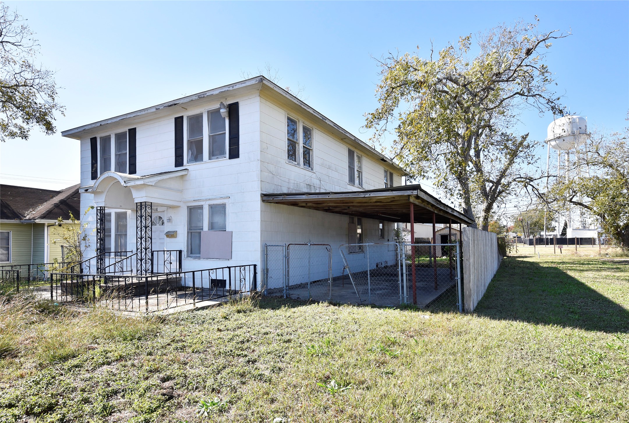 908 6th Street Rosenberg, TX 77471 - Photo 3 of 34 a front view of a house with a yard covered with snow