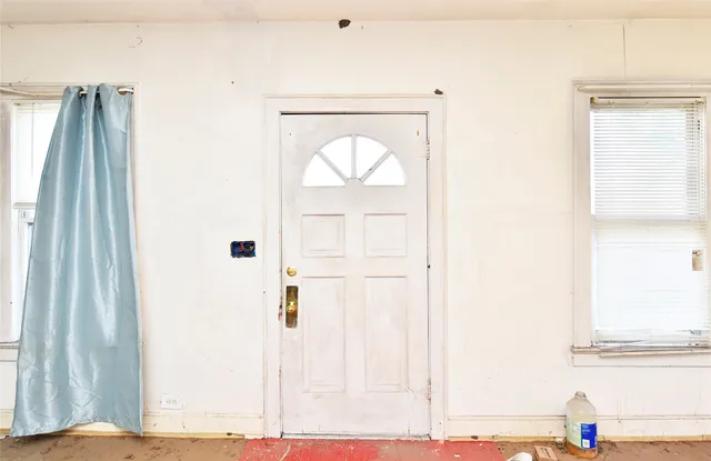 a large building with a clock on the door
