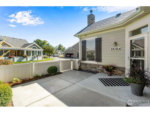 a view of a white house with a swimming pool