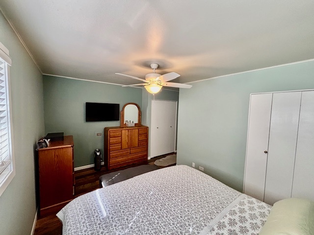 2106 Quail Court Rolling Meadows, IL 60008 - Photo 9 of 13 a bedroom with a bed and a flat screen tv