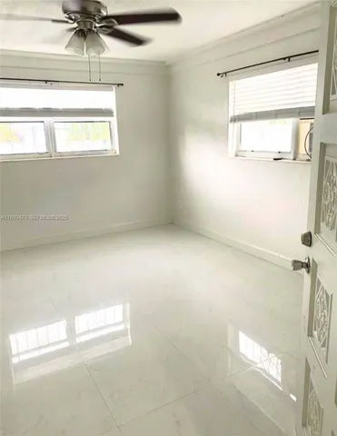 a view of empty room with a window