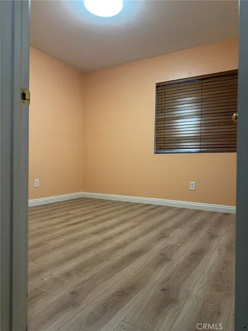 a bathroom with double sink and a mirror