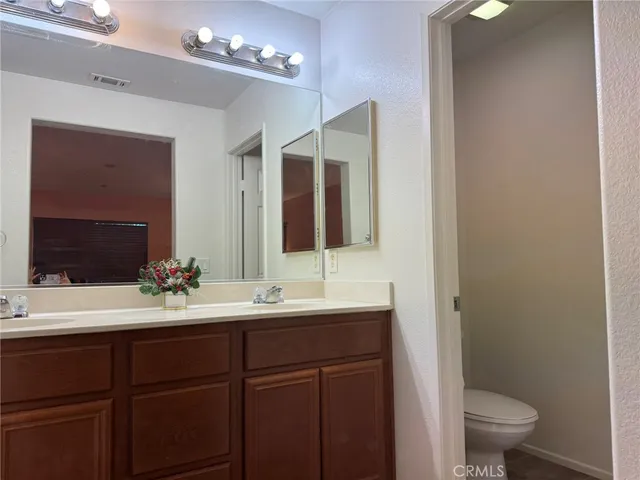 a bathroom with a toilet a sink and shower