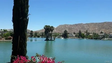 a view of a lake with houses in the back