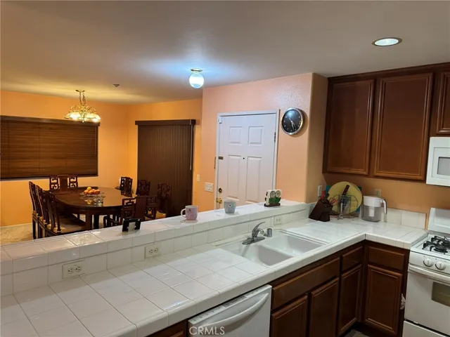 a kitchen with refrigerator and cabinets