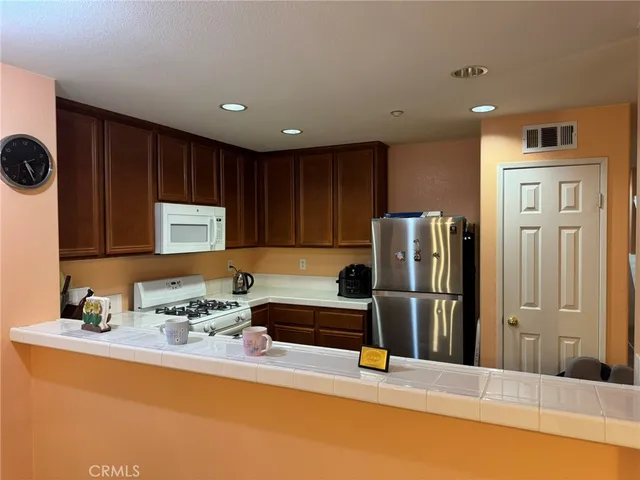 a utility room with sink dryer and washer
