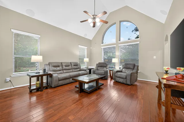 a living room with furniture window and wooden floor
