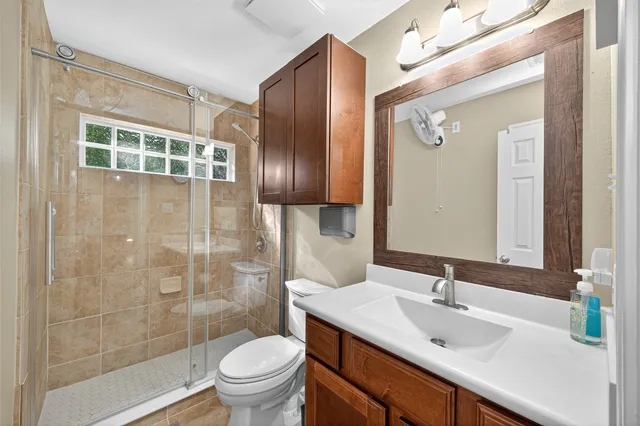 a view of a house with backyard and furniture