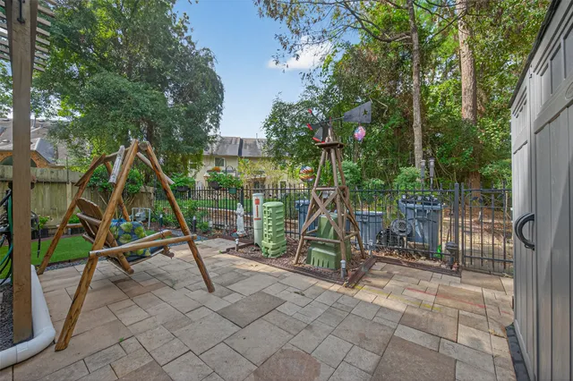 a front view of a house with a yard and potted plants