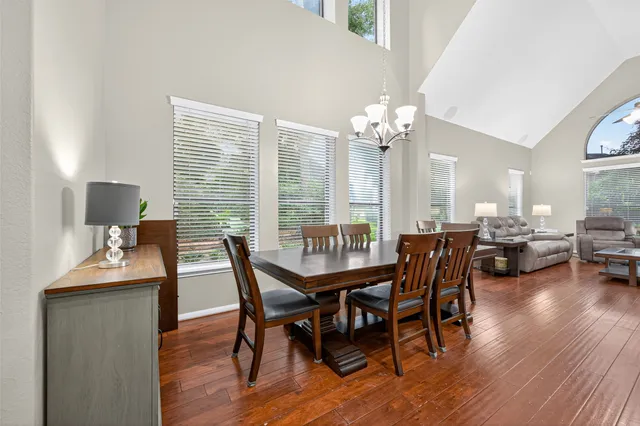 a view of a dining room with furniture window and wooden floor