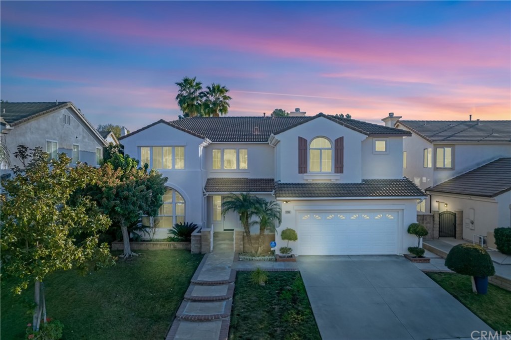 19366 Fortune Place Rowland Heights, CA 91748 - Photo 1 of 32 a front view of a house with a garden and plants