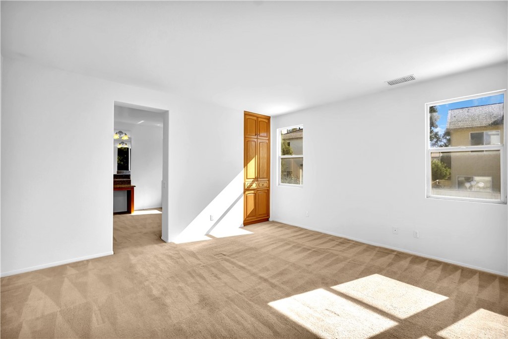 19366 Fortune Place Rowland Heights, CA 91748 - Photo 16 of 32 a view of an empty room with wooden floor and a window