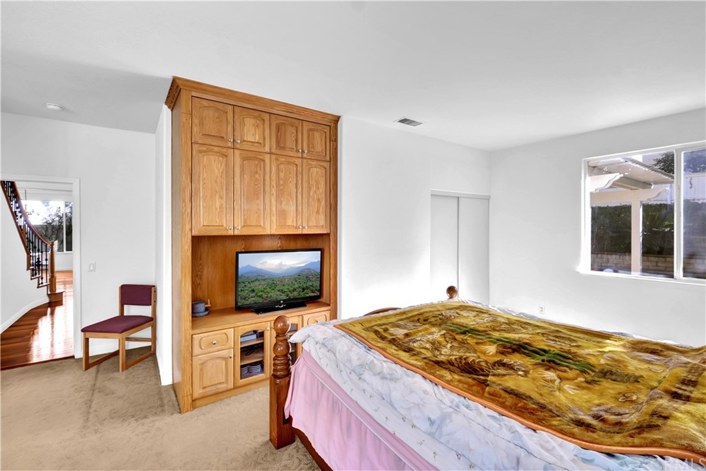 19366 Fortune Place Rowland Heights, CA 91748 - Photo 19 of 32 a bedroom with a bed and a flat screen tv