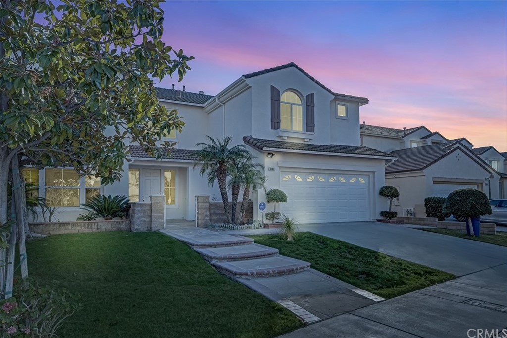 19366 Fortune Place Rowland Heights, CA 91748 - Photo 2 of 32 a front view of a house with a garden and plants