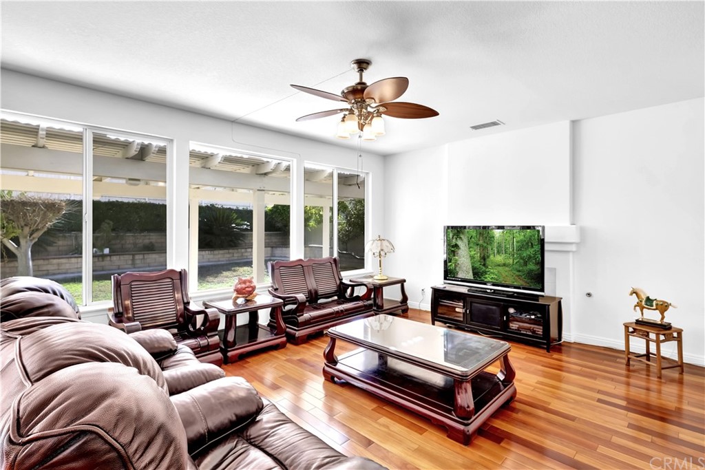 19366 Fortune Place Rowland Heights, CA 91748 - Photo 9 of 32 a living room with furniture flat screen tv and a large window