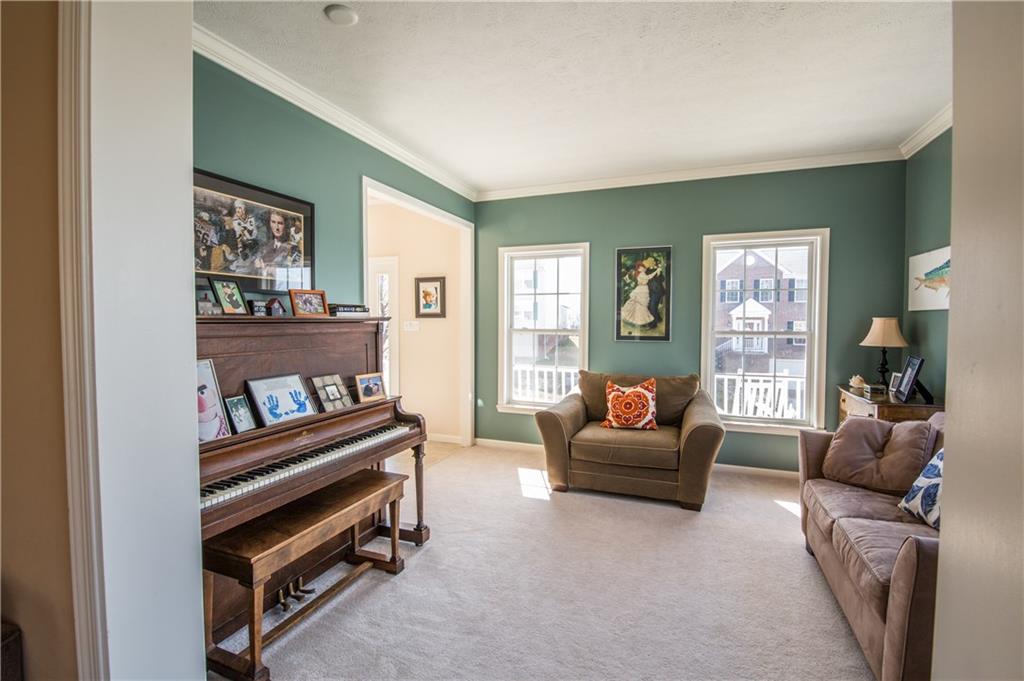 5009 Venice Road Pittsburgh, PA 15209 - Photo 10 of 25 Living room with crown molding and added side windows.