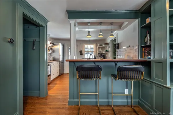 a kitchen with cabinets a sink and appliances