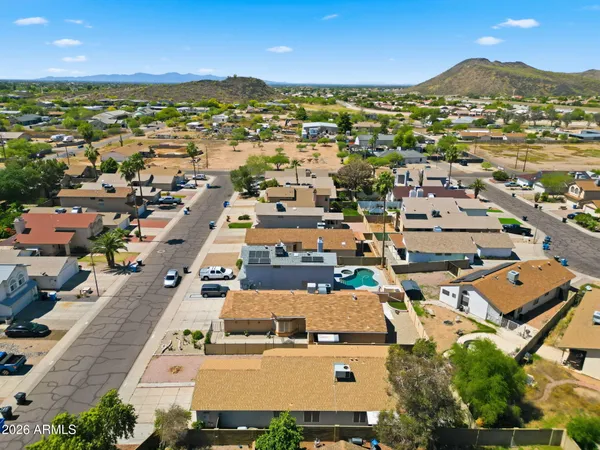 an aerial view of residential houses with outdoor space