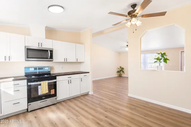 a kitchen with a stove a sink and a refrigerator