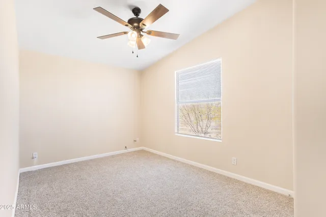 a bathroom with a double vanity sink mirror and toilet