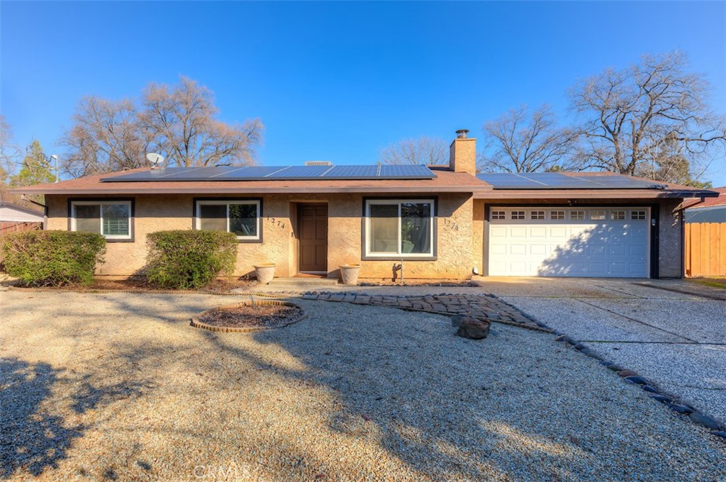 1274 Filbert Avenue Chico, CA 95926 - Photo 1 of 52 a front view of a house with a yard and garage