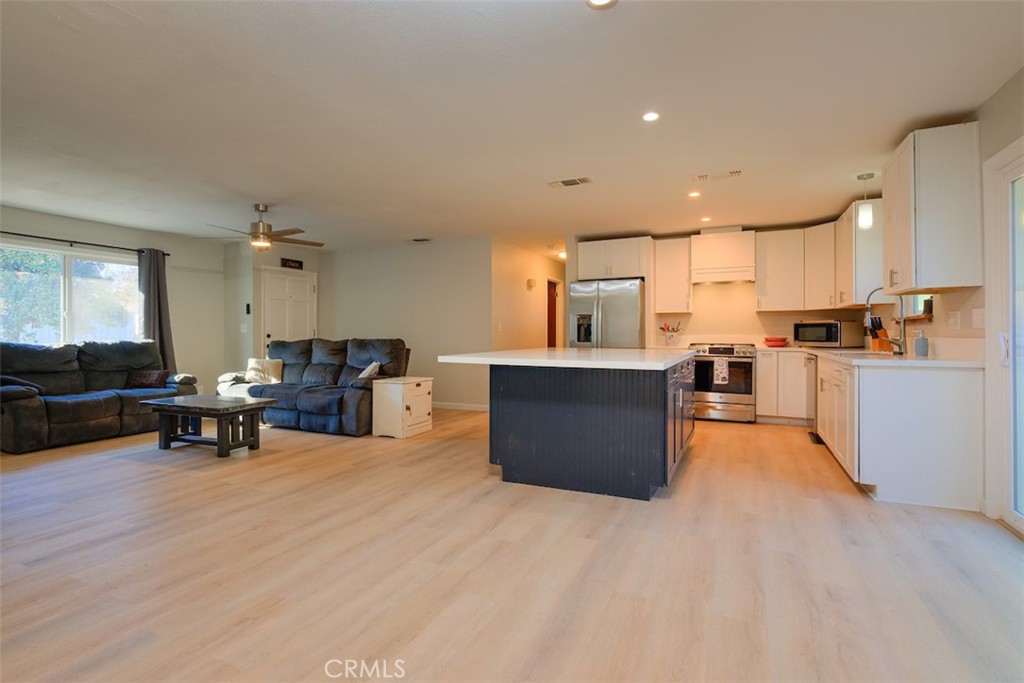 1274 Filbert Avenue Chico, CA 95926 - Photo 18 of 52 a view of kitchen with stainless steel appliances wooden floor and living room view