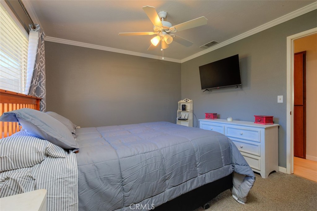 1274 Filbert Avenue Chico, CA 95926 - Photo 20 of 52 a bedroom with a bed and a flat screen tv
