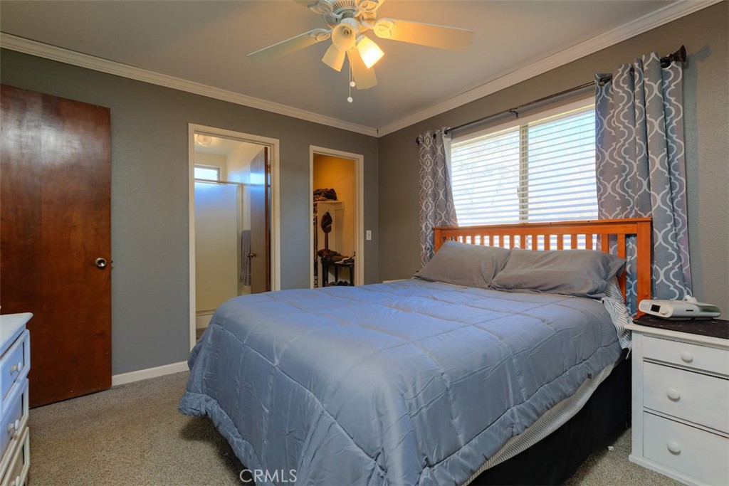 1274 Filbert Avenue Chico, CA 95926 - Photo 21 of 52 a bedroom with a bed and a chandelier