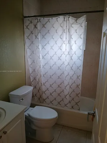 a view of a house with backyard porch and sitting area